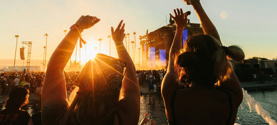 two woman at festival using eco-friendly skincare