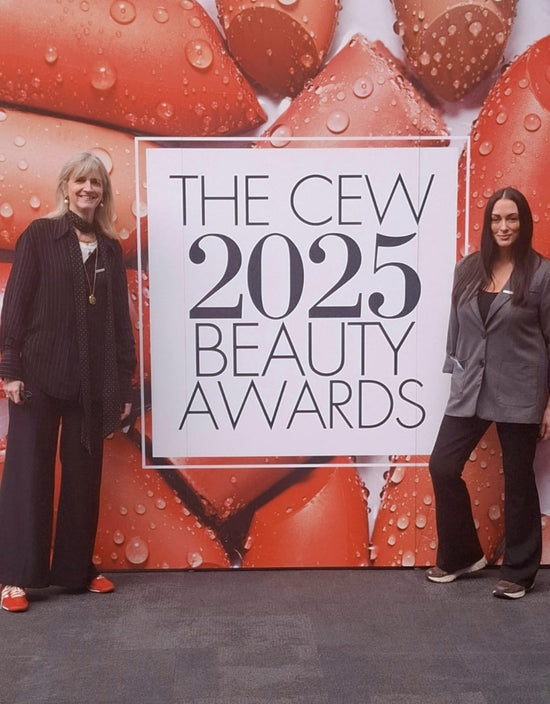 women standin infront of THE CEW 2025 BEAUTY AWARDS sign